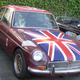Illustration for article titled Olde English 800-Fueled Driver Obliterates Union Jack-Adorned MGB-GT, We Struggle To Find Meaning